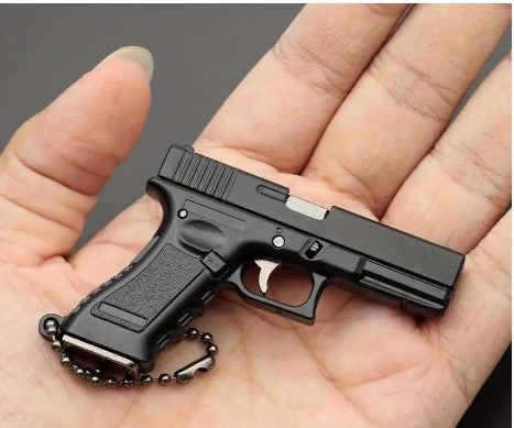 "Mini G17 Gun Model Keychain: A Tactical Marvel for Military Enthusiasts!"